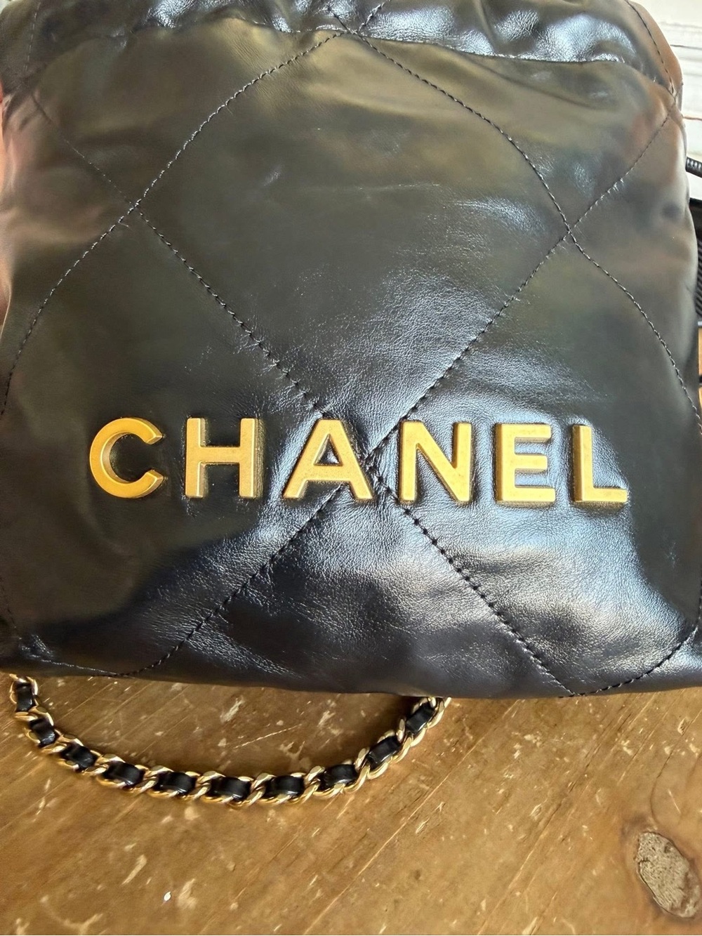 CHANEL Black Quilted Leather Mini Drawstring Bag with Gold Hardware - Picture 3 of 9
